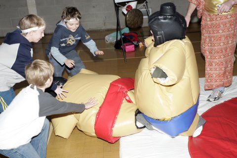 All rush to help up the defeated wrestler